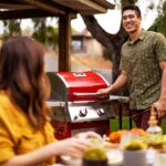 Nexgrill Deluxe 2 Burner Gas Grill, Compact with Foldable Shelves in Red | Offers 28000 BTU, Built-In Thermometer, Electronic Ignition, 401 Sq In Cooking Space with Warming Rack, 4 Wheel Transport - Image 7